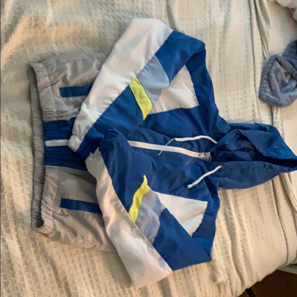 A Ross white blue and green rain jacket